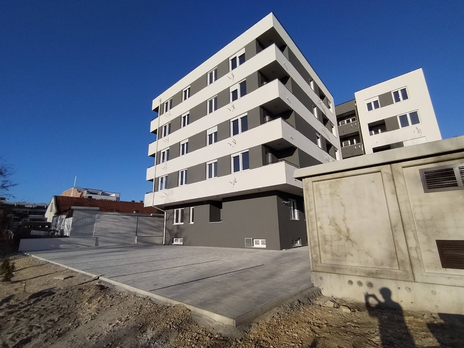 Rear courtyard and parking area of the Jerneja Kopitara residential development in Novi Sad, Serbia